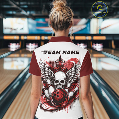 Back view of a woman in a bowling alley wearing a bowling shirt with quarter zip collar, red skull-themed bowling graphic with black wings, pins, bowling ball shirt with “Team Name” across the shoulders.