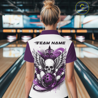 Back view of a woman in a bowling alley wearing a bowling shirt with quarter zip collar, purple skull-themed bowling graphic with black wings, pins, bowling ball shirt with “Team Name” across the shoulders.