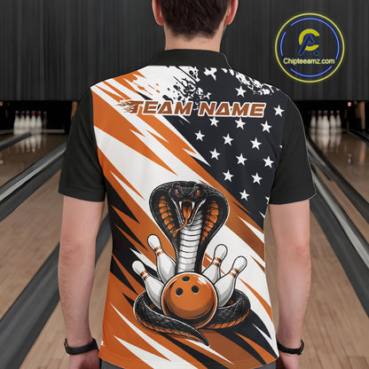 Back view of a man in a bowling alley wearing a black, white, and orange american flag cobra-themed shirt with “Team Name” across the shoulders.
