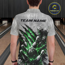 Load image into Gallery viewer, Back view of a male model wearing a gray bowling polo shirt showcasing a dramatic green bowling ball striking pins graphic with claw-mark artwork in a bowling lane.