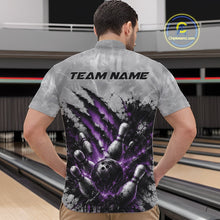 Load image into Gallery viewer, Front view of a male model wearing a gray bowling quarter zip shirt showcasing a dramatic purple bowling ball and pins graphic with claw-mark artwork at a bowling lane.