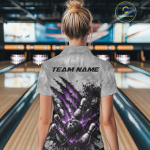 Load image into Gallery viewer, Back view of a female model wearing a gray bowling quarter zip shirt showcasing a dramatic purple bowling ball and pins graphic with claw-mark artwork in a bowling lane.