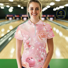 Load image into Gallery viewer, Female model at a bowling lane wearing a quarter-zip bowling shirt with sparkling butterfly motifs, diamonds, bowling pins, and a bowling ball design.