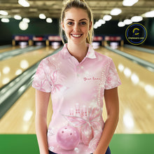 Load image into Gallery viewer, Female model wearing a bowling polo shirt in a bowling center with pink glitter butterflies, diamonds, bowling pins, and bowling-themed artwork.