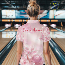 Load image into Gallery viewer, Back view of a female model at a bowling lane wearing a polo shirt featuring glitter butterfly motifs, diamonds, bowling pins, and a bowling ball.