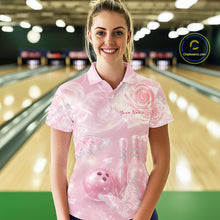 Load image into Gallery viewer, Female model at a bowling lane wearing a bowling polo shirt with pink glitter butterfly artwork, roses, bowling pins, and a bowling ball on the front.