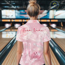 Load image into Gallery viewer, Back view of a female model wearing a bowling polo shirt featuring sparkling pink butterflies, floral roses, bowling pins, and bowling ball graphics.