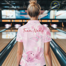 Load image into Gallery viewer, Back view of a female model in a bowling center wearing a quarter-zip bowling shirt with pink glitter butterflies, roses, bowling pins, and bowling graphics.