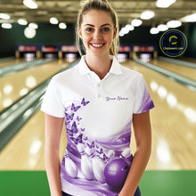 Load image into Gallery viewer, Front view of a female model wearing a white and purple bowling polo shirt featuring butterfly accents and bowling graphics at the bowling lane.
