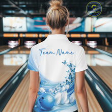 Load image into Gallery viewer, Back view of a women s white and blue bowling quarter zip showcasing butterfly artwork and bowling-themed graphics at the bowling lane.