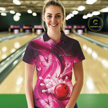 Load image into Gallery viewer, Female model in a bowling center wearing a pink bowling polo decorated with bowling action artwork and butterflies.