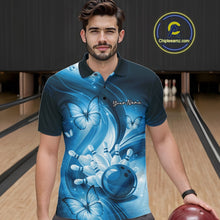 Load image into Gallery viewer, Male model wearing a blue bowling polo in a bowling alley with bowling action artwork and butterfly accents.