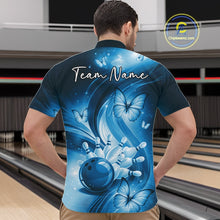 Load image into Gallery viewer, Front view of a blue bowling quarter-zip showcasing a bowling ball hitting pins with colorful butterfly accents.
