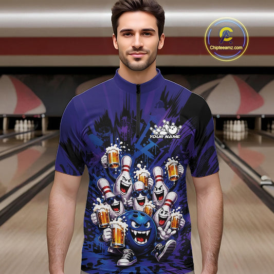 Male model wearing a blue and purple bowling quarter-zip shirt at a bowling lane showcasing playful artwork of funny bowling pins and a bowling ball holding frothy beer mugs.