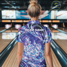 Load image into Gallery viewer, Back view female model in bowling lane wearing quarter zip shirt featuring galaxy style bowling ball striking pins with vibrant cosmic bowling graphics.