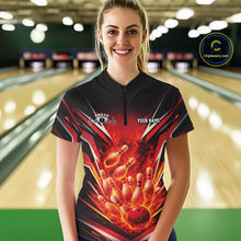 Load image into Gallery viewer, Front view female model in bowling lane wearing black and red quarter zip shirt showing flaming bowling ball striking pins with intense fire illustration.