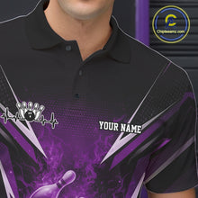 Load image into Gallery viewer, Close-up of the left chest graphic on a black and purple bowling polo featuring a flaming bowling strike illustration.