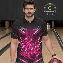 Load image into Gallery viewer, Front view of a male model at the bowling lane wearing a black and pink polo with energetic bowling strike artwork and flames.