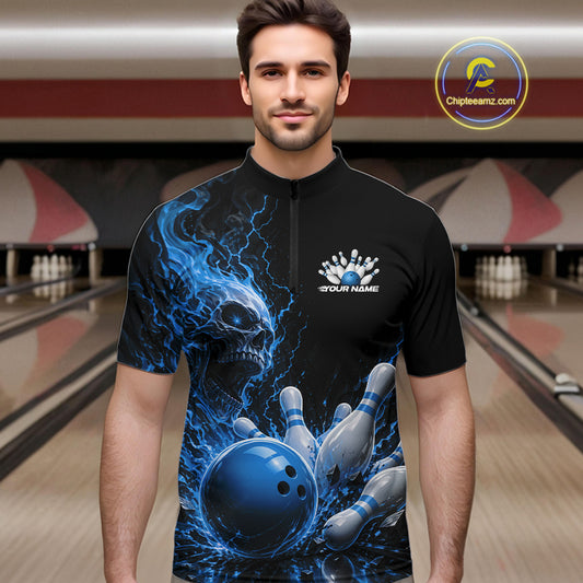 Front view of a male model in a bowling alley wearing a black bowling quarter zip shirt featuring a blue fiery skull design with lightning striking a bowling ball and pins and a custom name.
