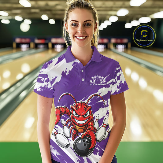 Front view of a female model in a bowling alley wearing a purple custom bowling polo shirt with a fierce yet funny crawfish bowling character and a distressed background design.
