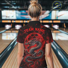 Load image into Gallery viewer, Back view of a female model in a bowling alley wearing a red custom bowling polo shirt featuring an ancient dragon, flames, and a moon-inspired bowling ball design.