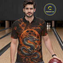 Load image into Gallery viewer, Front view of a male model in a bowling alley wearing an orange custom bowling polo shirt featuring an ancient dragon, flames, and a moon-inspired bowling ball design.