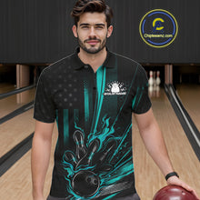 Load image into Gallery viewer, Male model wearing a black and turquoise blue bowling polo shirt at a bowling lane with patriotic bowling graphics and flame accents.