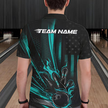 Load image into Gallery viewer, Back view of a male model in a bowling center wearing a black and turquoise blue polo showcasing bowling strike artwork with distressed flag styling.