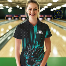 Load image into Gallery viewer, Female model wearing a black and turquoise blue bowling polo shirt at a bowling lane with patriotic bowling strike graphics and flag-inspired accents.