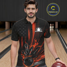 Load image into Gallery viewer, Male model at a bowling lane wearing a black and orange polo shirt with fiery bowling strike artwork and patriotic styling.