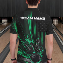 Load image into Gallery viewer, Back view of a male model in a bowling center wearing a black and green polo featuring a flaming bowling ball and distressed flag design.