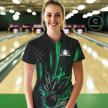 Load image into Gallery viewer, Female model wearing a black and green bowling polo shirt at a bowling lane showcasing patriotic bowling strike artwork with distressed flag styling.