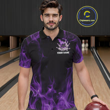 Load image into Gallery viewer, Male model at a bowling lane wearing a black and purple polo shirt with bowling action graphics and fiery design elements.