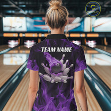 Load image into Gallery viewer, Back view of a female model in a bowling alley wearing a black and purple bowling polo with a flaming bowling strike and scattered pins design.