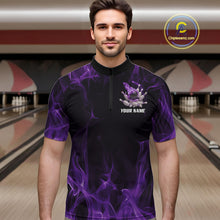 Load image into Gallery viewer, Male model at a bowling lane wearing a black and purple bowling quarter-zip shirt with bowling strike graphics and fiery accents.