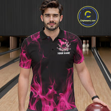 Load image into Gallery viewer, Male model wearing a black and pink bowling polo shirt at a bowling lane with dynamic bowling strike artwork and fiery accents.