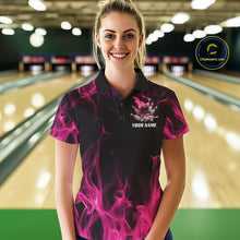Load image into Gallery viewer, Female model wearing a black and pink bowling polo shirt at a bowling lane with dynamic bowling strike artwork, scattered pins, and fiery accents.