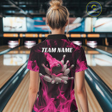 Load image into Gallery viewer, Back view of a female model in a bowling lane wearing a black and pink polo shirt featuring a bowling ball crashing into scattered pins with a flames background.