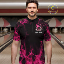 Load image into Gallery viewer, Male model wearing a black and pink bowling quarter-zip shirt at a bowling lane with bowling action artwork and fiery background details.