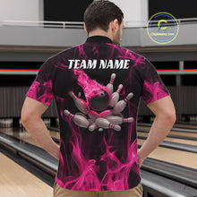 Load image into Gallery viewer, Front view of a male model in a bowling alley wearing a black and pink quarter-zip shirt featuring scattered bowling pins and flame-themed graphics.