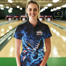 Load image into Gallery viewer, Front view of a female model at the bowling lane wearing a polo shirt with flaming eagle artwork, blue bowling ball, American flag, and blue flames.