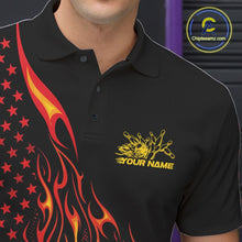 Load image into Gallery viewer, Close-up of the left chest area on a black bowling polo shirt featuring a red-orange flaming bowling ball striking pins with patriotic styling.
