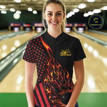 Load image into Gallery viewer, Female model at a bowling lane wearing a black bowling quarter-zip shirt with red-orange flame bowling strike artwork and American flag details.