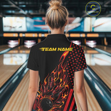 Load image into Gallery viewer, Back view of a female model in a bowling venue wearing a black quarter-zip shirt featuring fiery bowling pin graphics and patriotic accents.