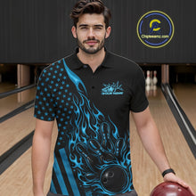Load image into Gallery viewer, Male model wearing a black bowling polo shirt at a bowling lane with blue flame bowling strike artwork and patriotic accents.