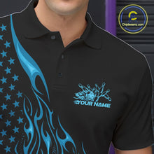 Load image into Gallery viewer, Close-up left chest view of a black bowling polo shirt featuring a blue flaming bowling ball striking pins with patriotic American flag accents.