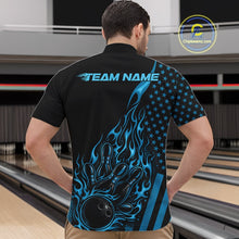 Load image into Gallery viewer, Front view of a male model in a bowling alley wearing a black quarter-zip shirt featuring a blue flaming bowling ball knocking down pins.