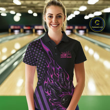 Load image into Gallery viewer, Female model at a bowling lane wearing a black bowling polo shirt with pink and purple flame bowling artwork and American flag accents.
