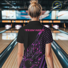 Load image into Gallery viewer, Back view of a female model in a bowling center wearing a black quarter-zip shirt showcasing a flaming bowling ball and patriotic pin graphics.