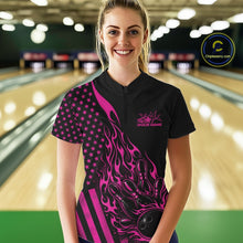 Load image into Gallery viewer, Female model wearing a black bowling quarter-zip shirt at a bowling lane with a pink flaming bowling ball knocking down pins and patriotic graphics.